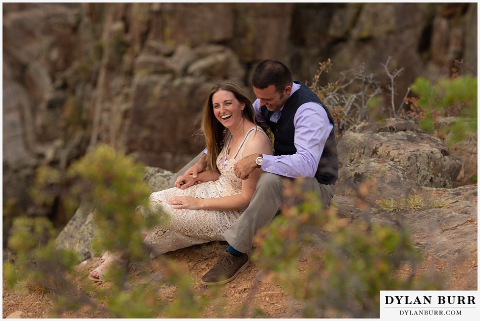 black canyon colorado elopement wedding adventure bride and groom laughing together near the canyon ledge