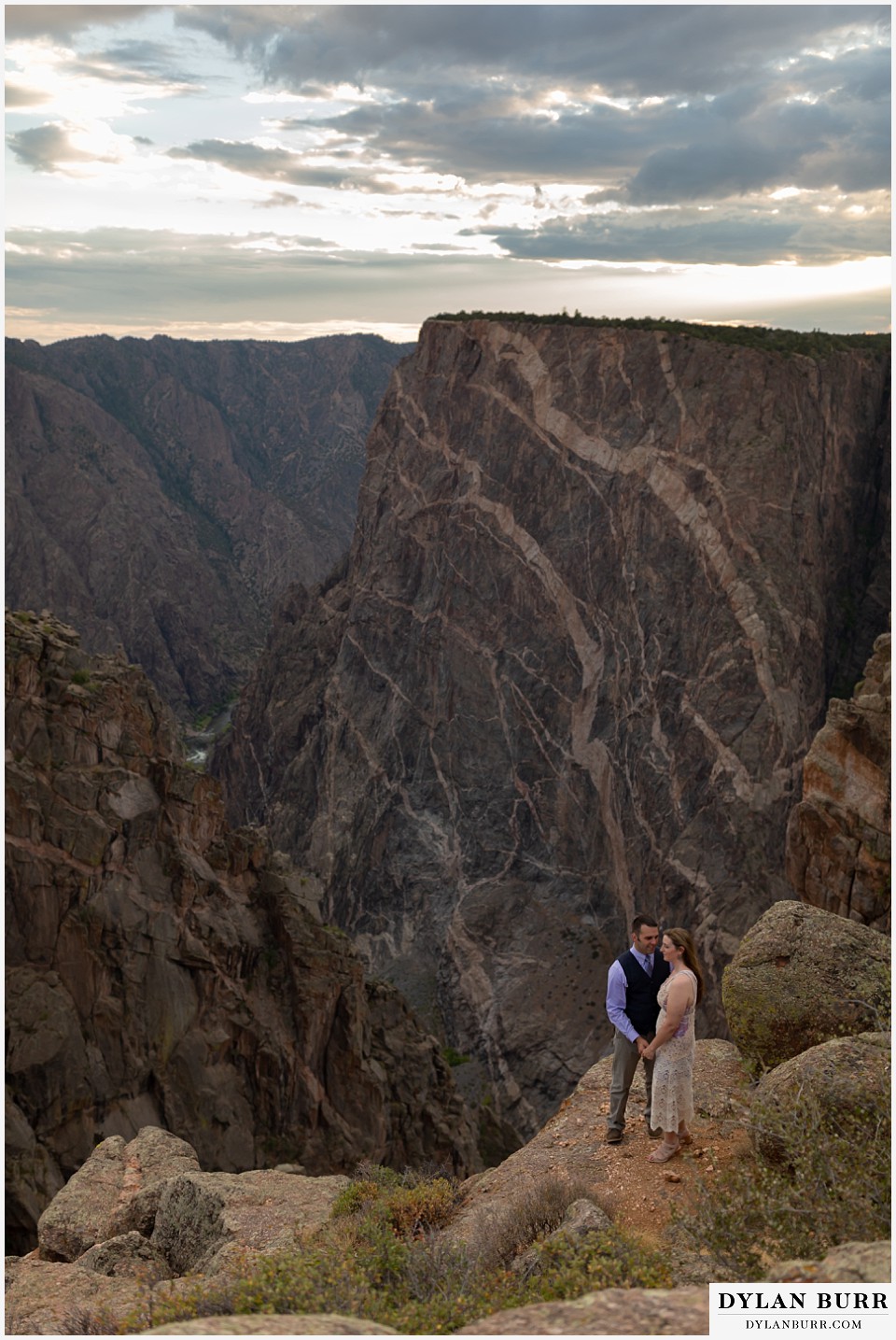 black canyon colorado elopement wedding adventure bride and groom at the painted wall huge canyon view