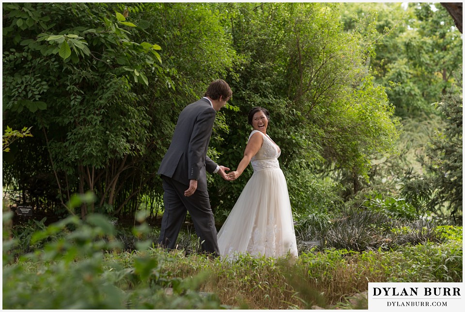 denver botanic gardens wedding colorado woodland mosaic bride groom laughing and walking together