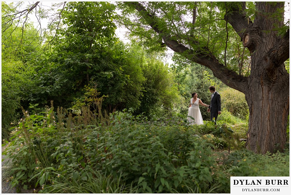 denver botanic gardens wedding colorado woodland mosaic bride groom wandering the gardens together
