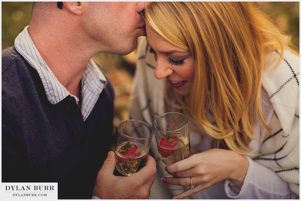 denver fall engagement photos champagne toast with strawberries