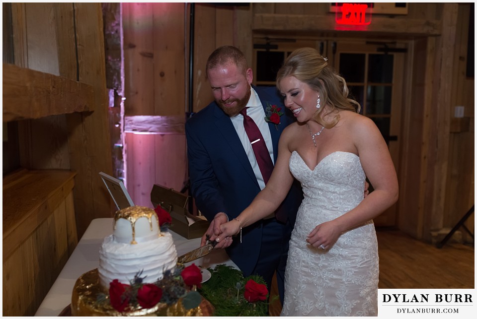 devils thumb ranch wedding in winter reception cake cutting