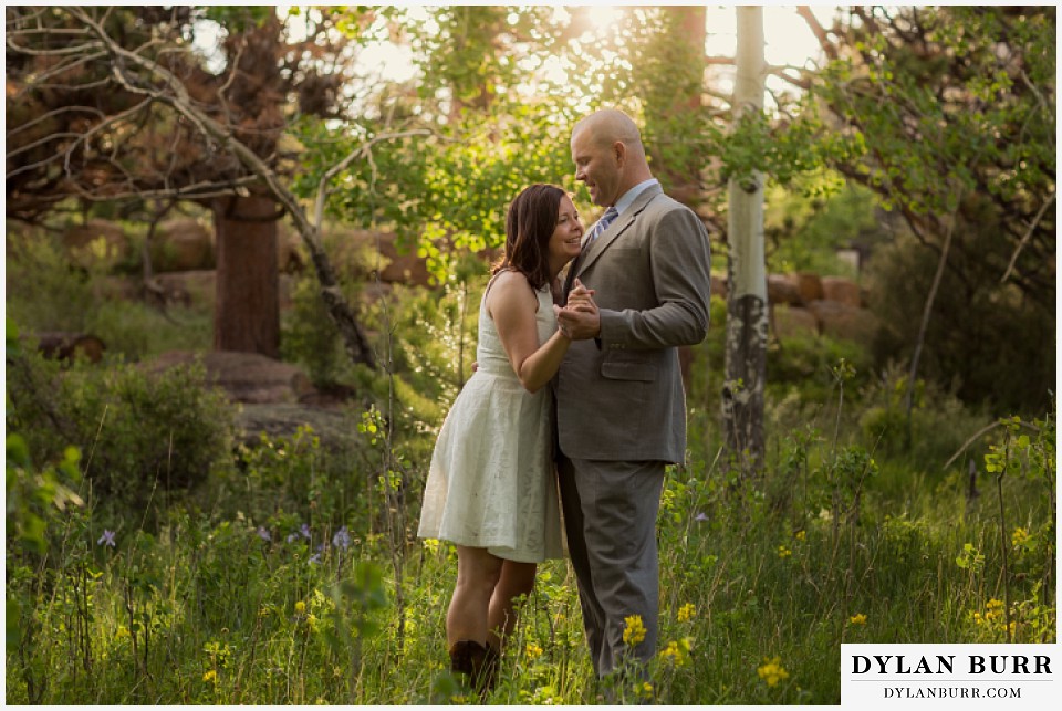 rocky mountain estes park engagement session holding eachother in meadow