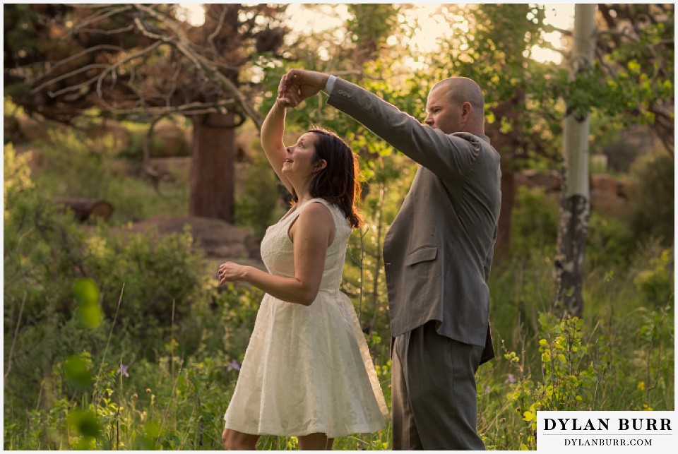 rocky mountain estes park engagement session dancing together in meadow