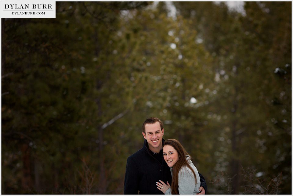 estes park engagement photos winter pine trees