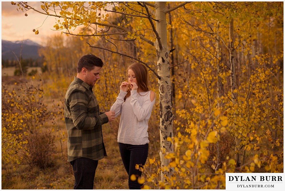 colorado mountains fall engagement photo session playing together