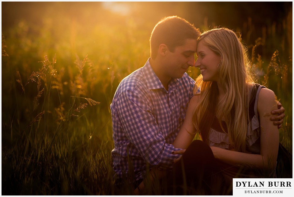 how to prepare for my engagement session couple sitting at sunset