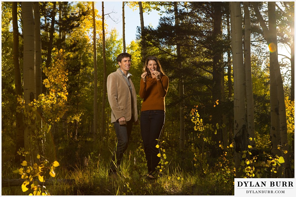 how to prepare for my engagement session couple laughing together in aspen trees