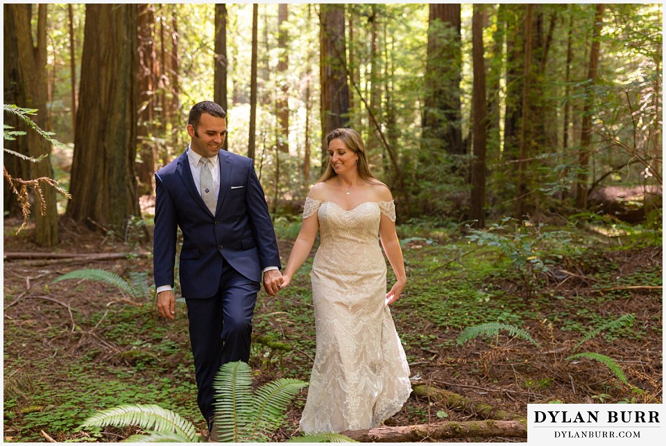 redwood forest wedding elopement avenue of the giants california bride and groom walking together in forest