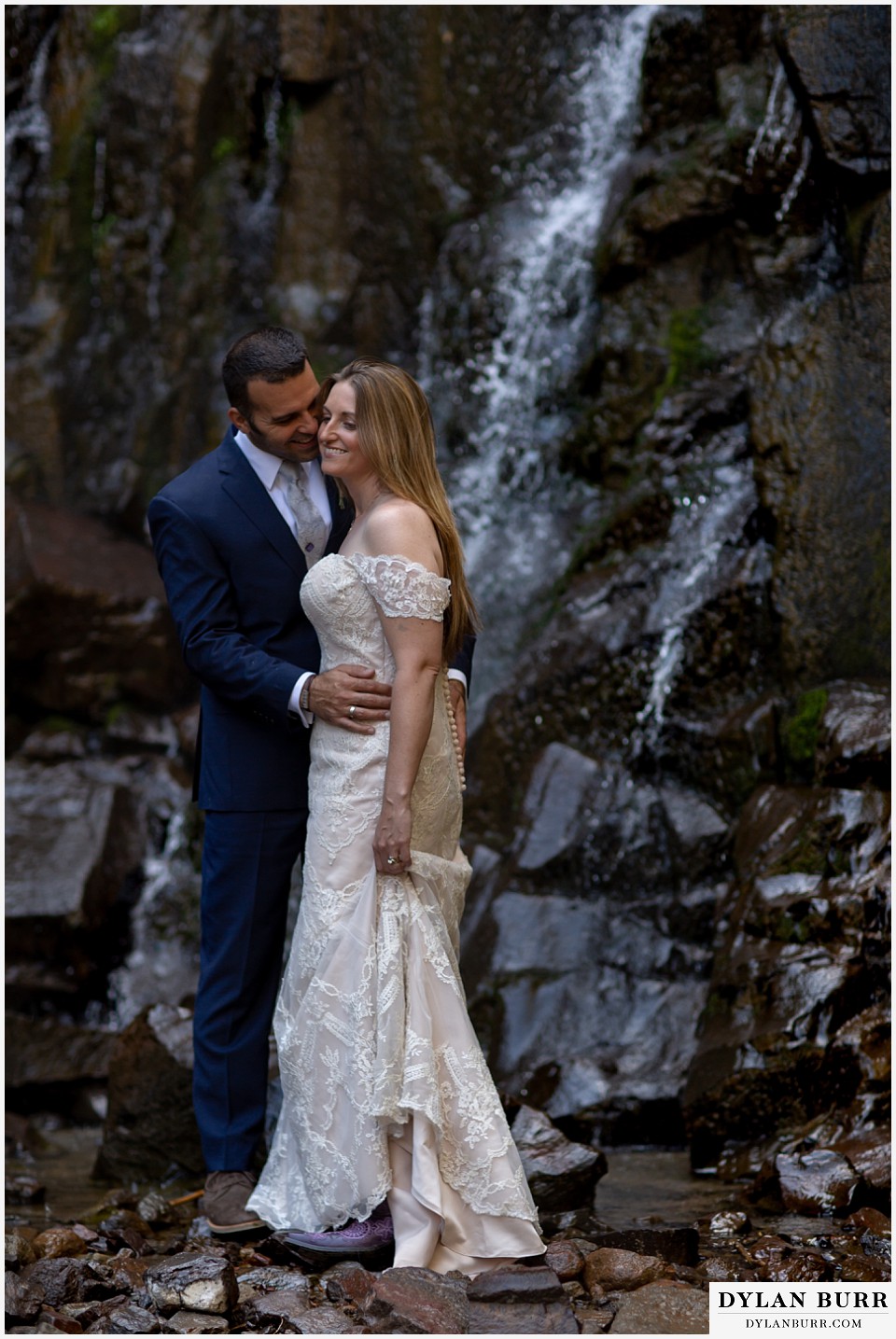 uncompahgre national forest colorado elopement wedding adventure bride and groom kissing at waterfall