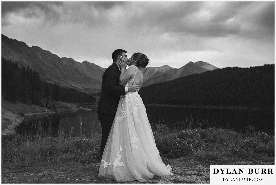 10 mile wedding hall wedding couple kissing by a lake