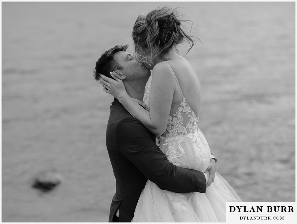 newlyweds by a lake in breckenridge colorado