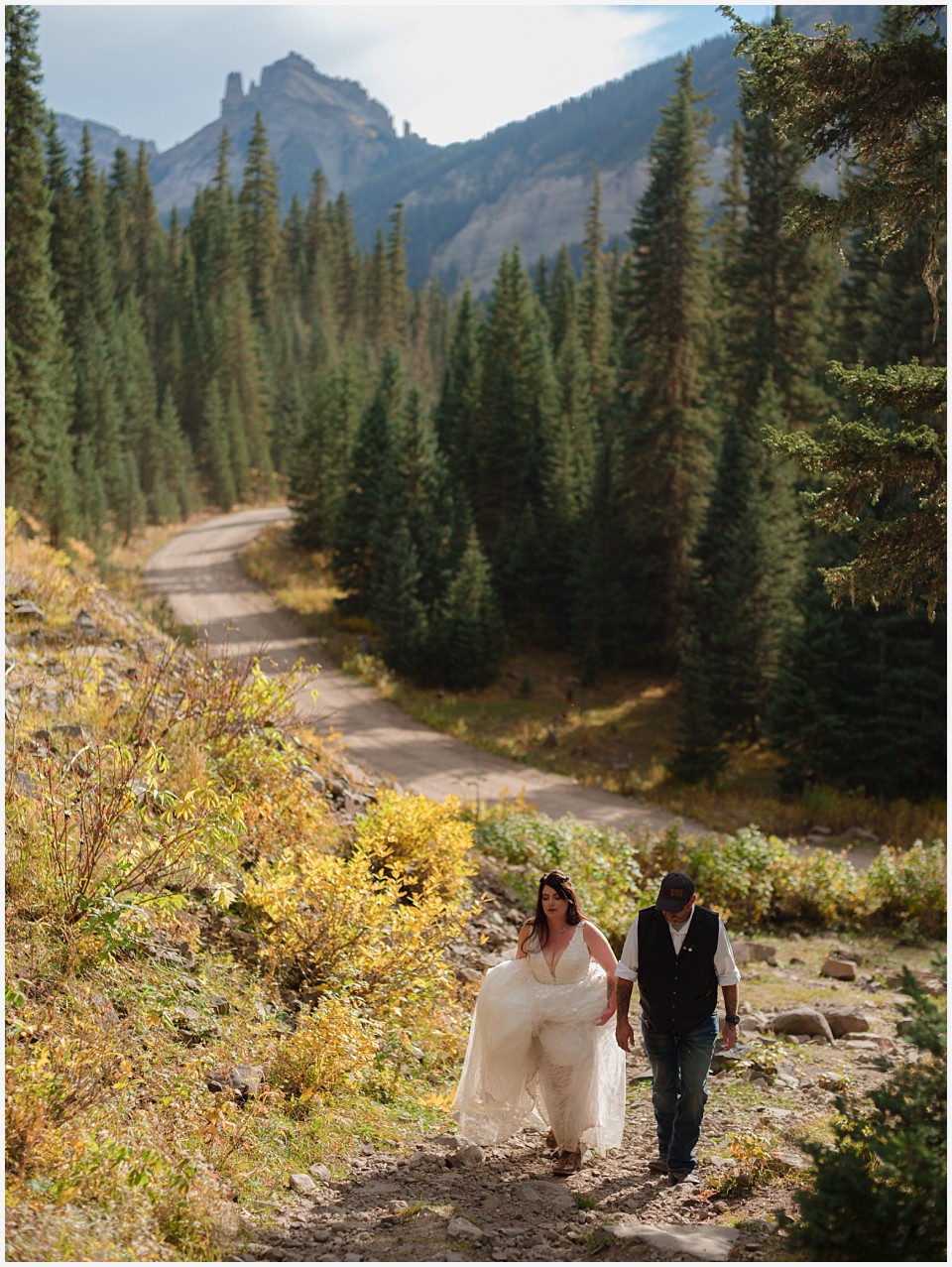 adventure elopement western colorado bride and groom hiking on trail