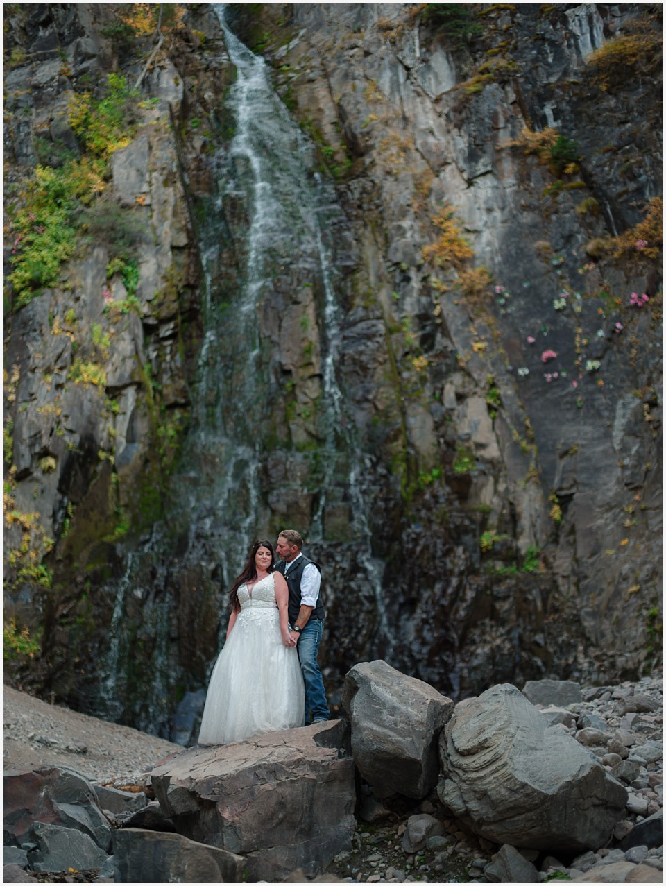 adventure elopement western colorado couple waterfall kisses