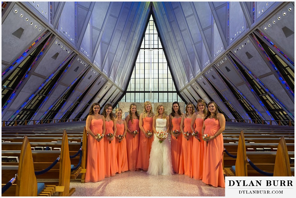 air force academy wedding bride and her bridesmaids in aisle