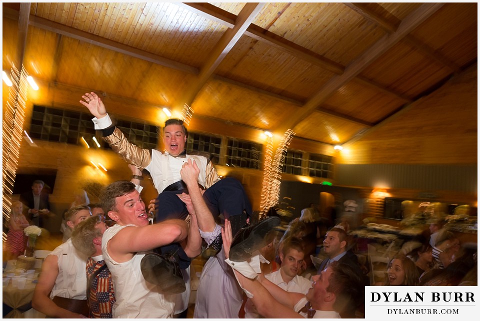 Pinecrest Weddings and Event Center throwing groom in the air
