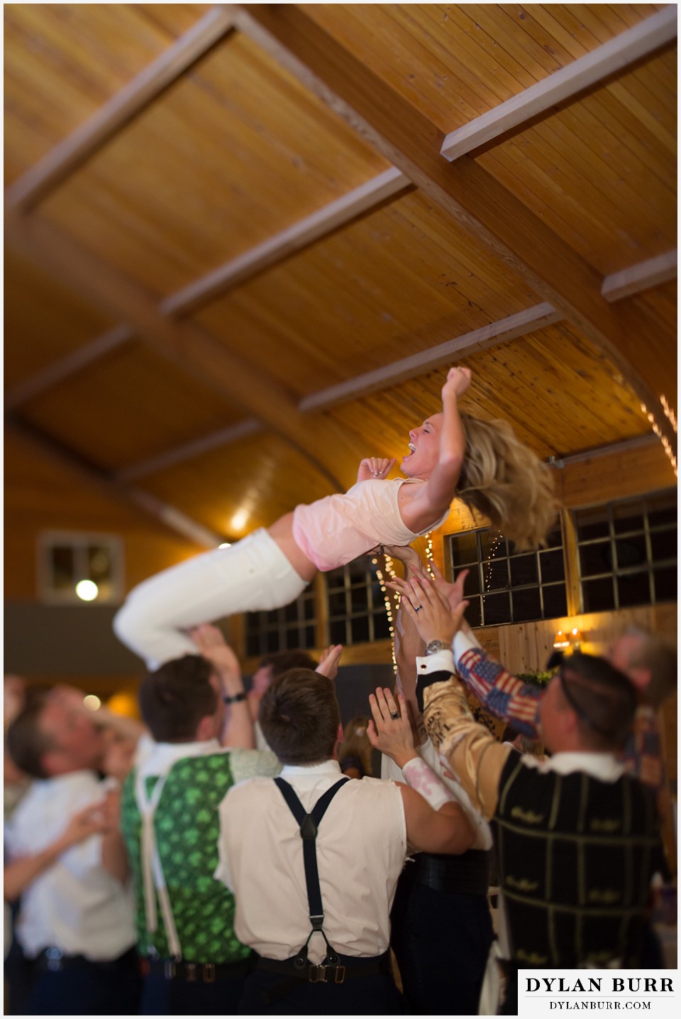 Pinecrest Weddings and Event Center throwing bride in the air