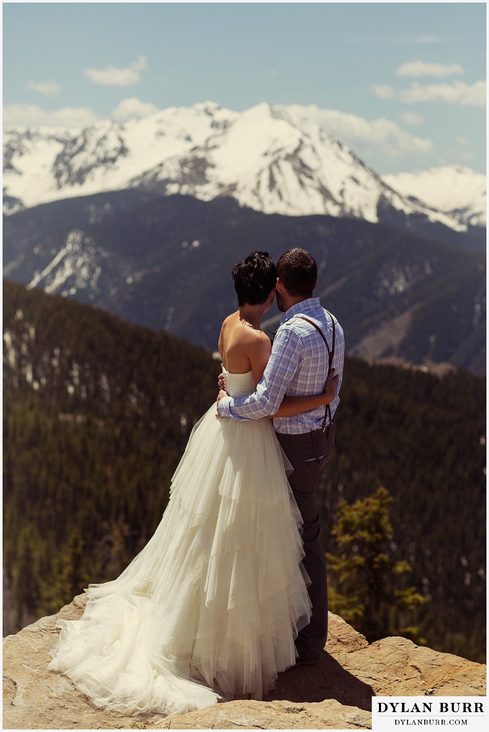 aspen wedding elopement bride and groom looking out at mountains