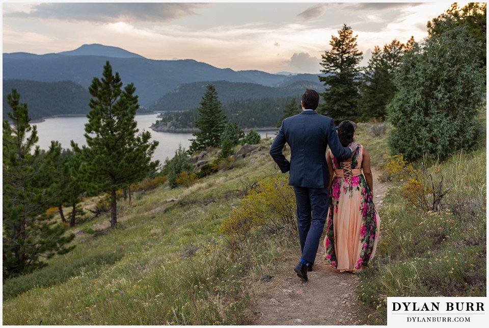 boulder colorado engagement session in the mountains walking on trail towards lake