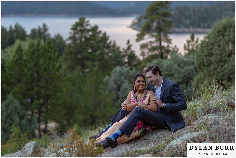 boulder colorado engagement session in the mountains couple sitting on rock