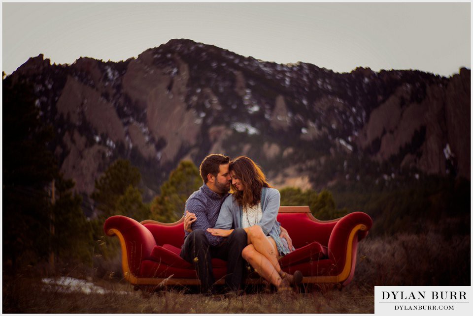 engagement photos-in boulder cuddling on antique couch