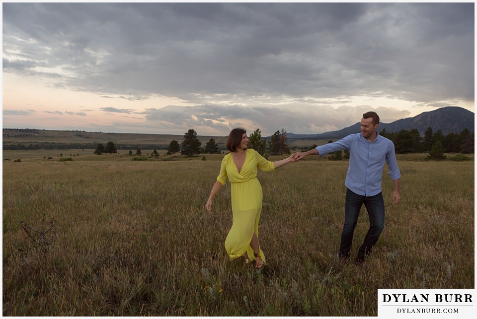 boulder wedding engagement session dacing in field