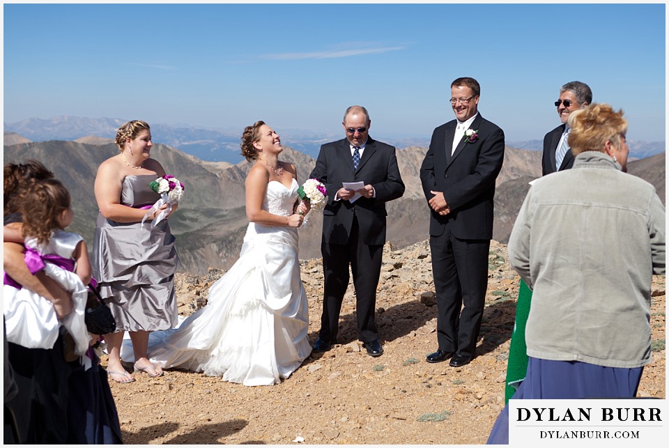 breckenridge 4wd adventure wedding bride and groom laughing together on mountain top