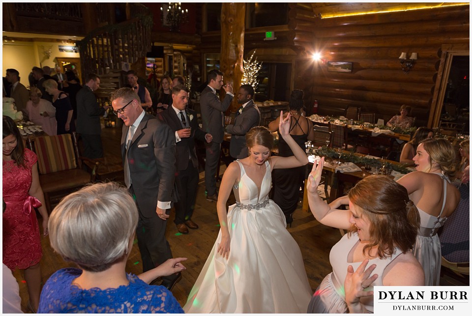 breckenridge nordic center wedding colorado mountain wedding photographer kicking off the reception