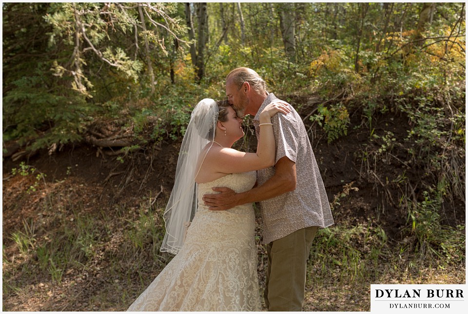 buford lodge wedding buford colorado meeker first look with dad kissing daughter