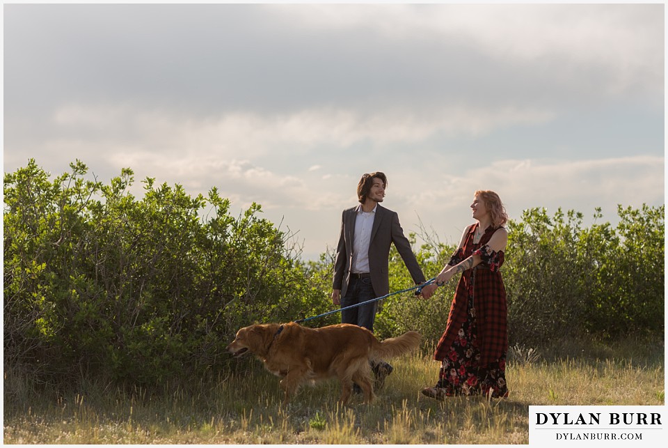 castle rock colorado engagement session walking with golden retriever