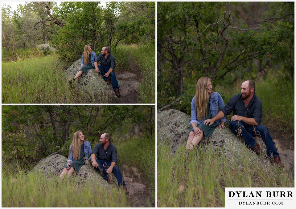castlewood canyon engagement photos couple sitting on rock together