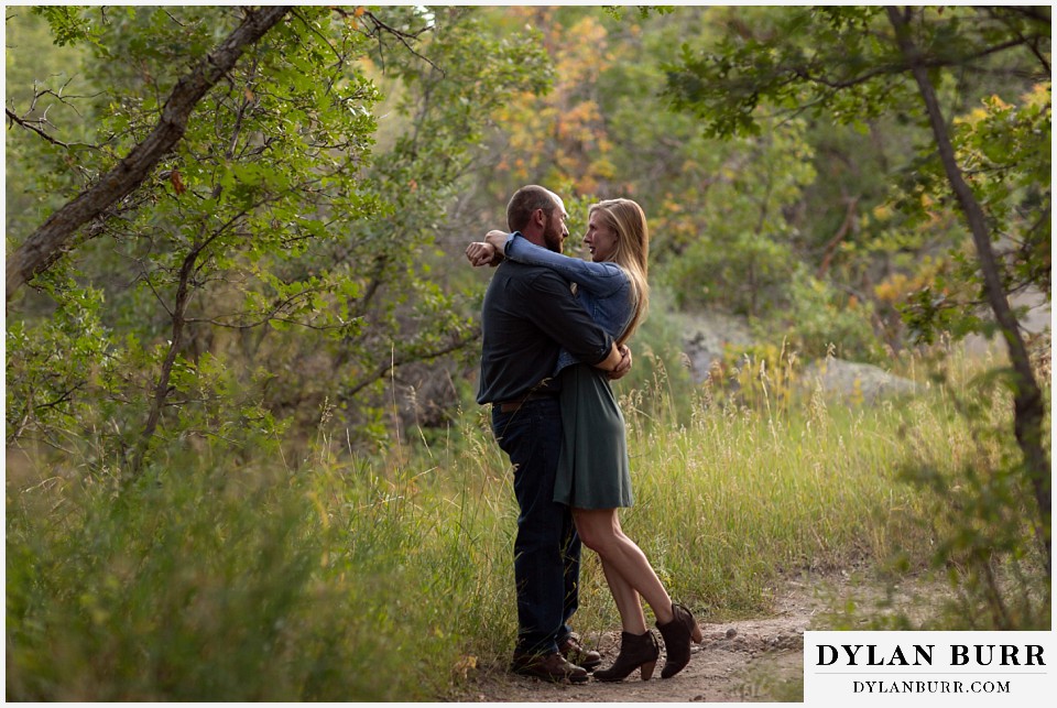 castlewood canyon engagement photos couple sharing a hug