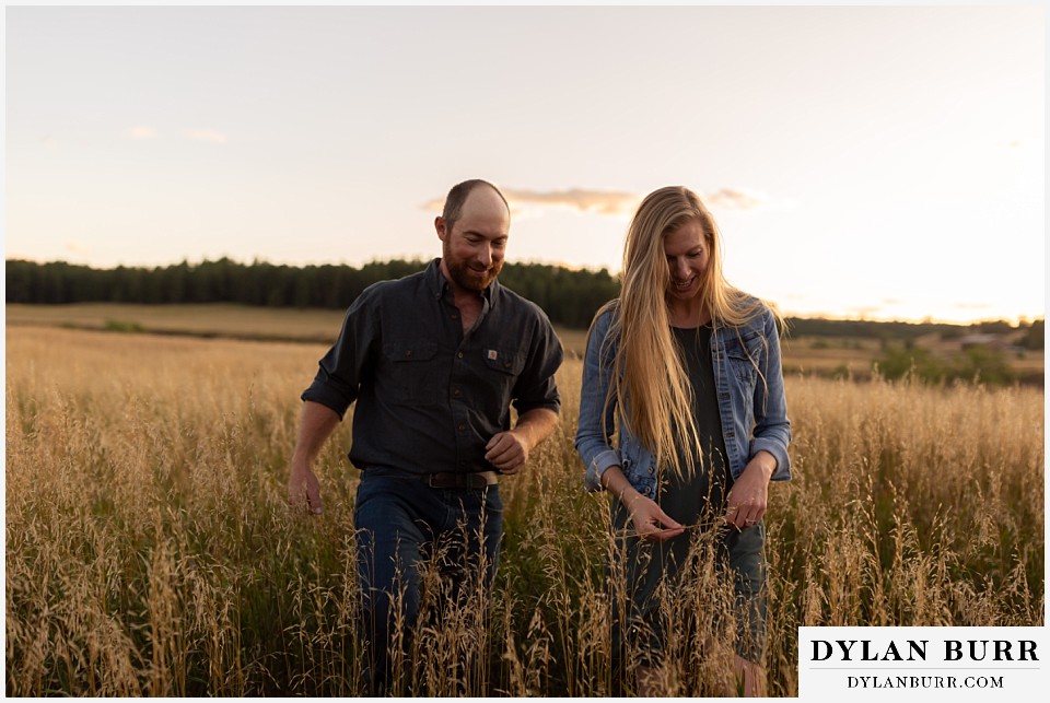 castlewood canyon engagement photos couple in old lake bed grassy meadow