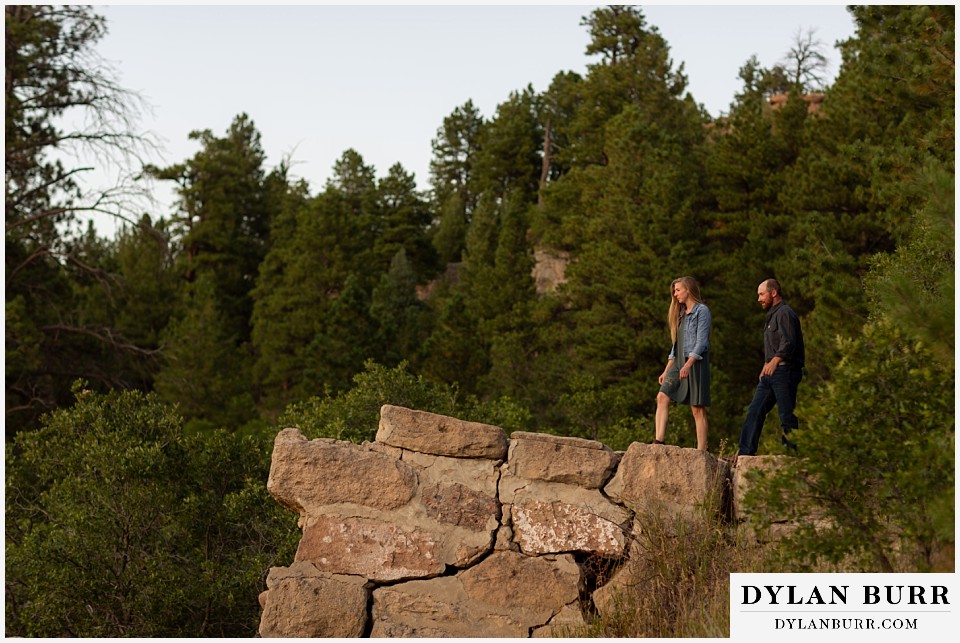 castlewood canyon engagement photos couple walking out on old stone structure