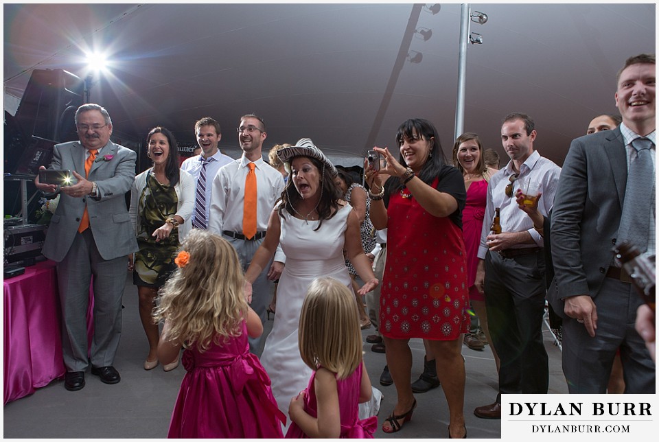 chatfield farms wedding botanic gardens bride dancing with guests with photo booth props