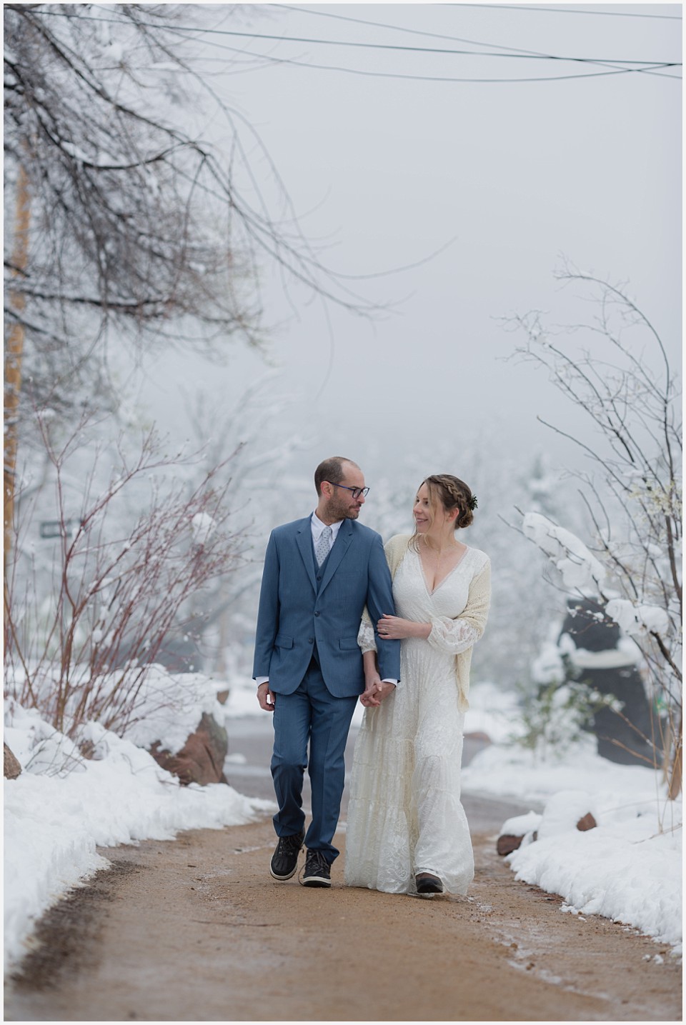 chautauqua community house wedding couple walking in snowy spring fog