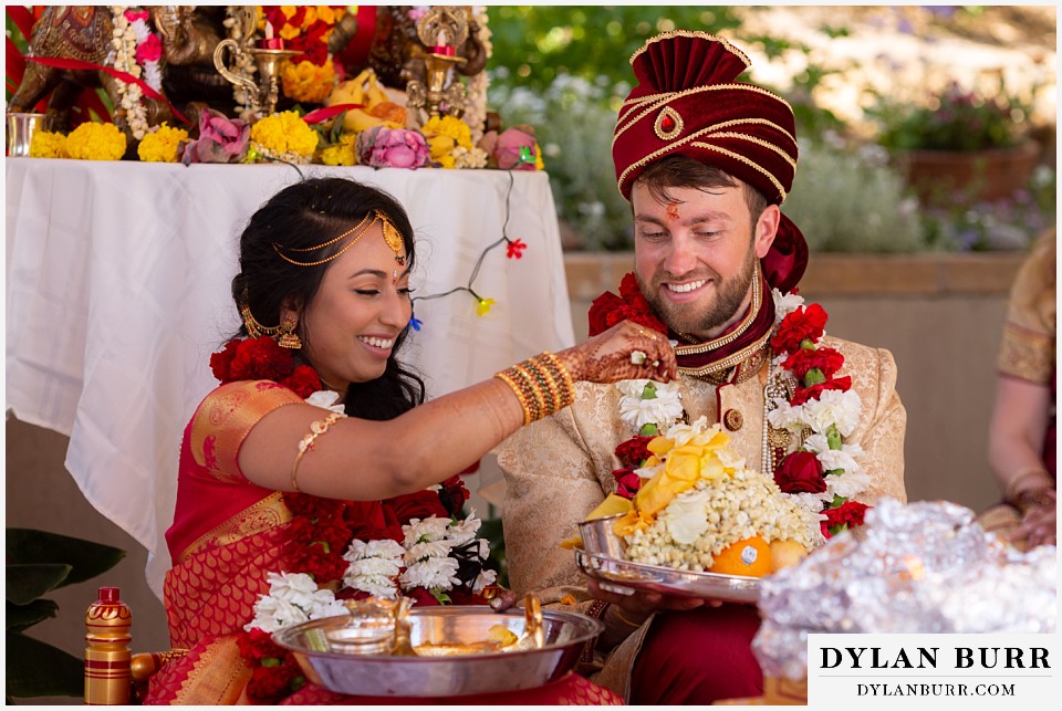 cielo at castle pines wedding colorado mountain wedding bride and groom very happy during hindu ceremony