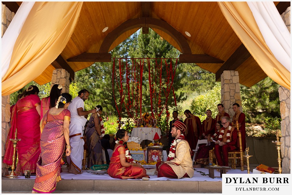 cielo at castle pines wedding colorado mountain wedding bride and groom under mandap hindu ceremony