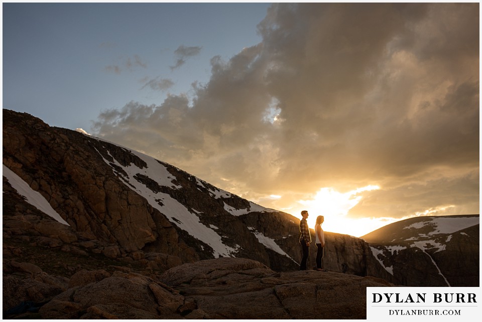 colorado mountain enagagement photo session wide mountain view of couple at sunset