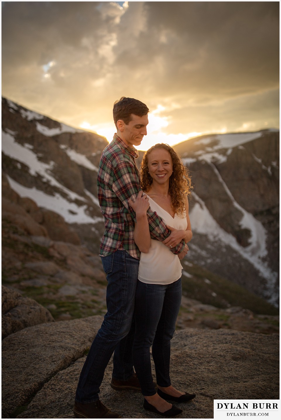 colorado mountain enagagement photo session couple taking a minute on the mountain top