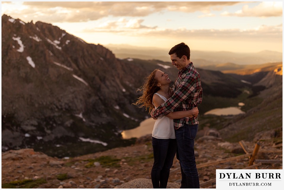 colorado mountain enagagement photo session couple hiking in mountains at sunset