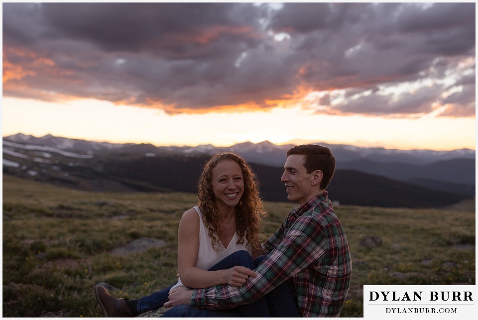 colorado mountain enagagement photo session couple laughing in the mountains