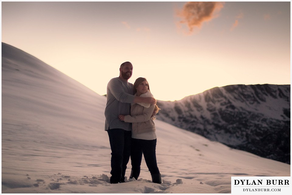 colorado mountain engagement session holding eachother and enjoying the sunset