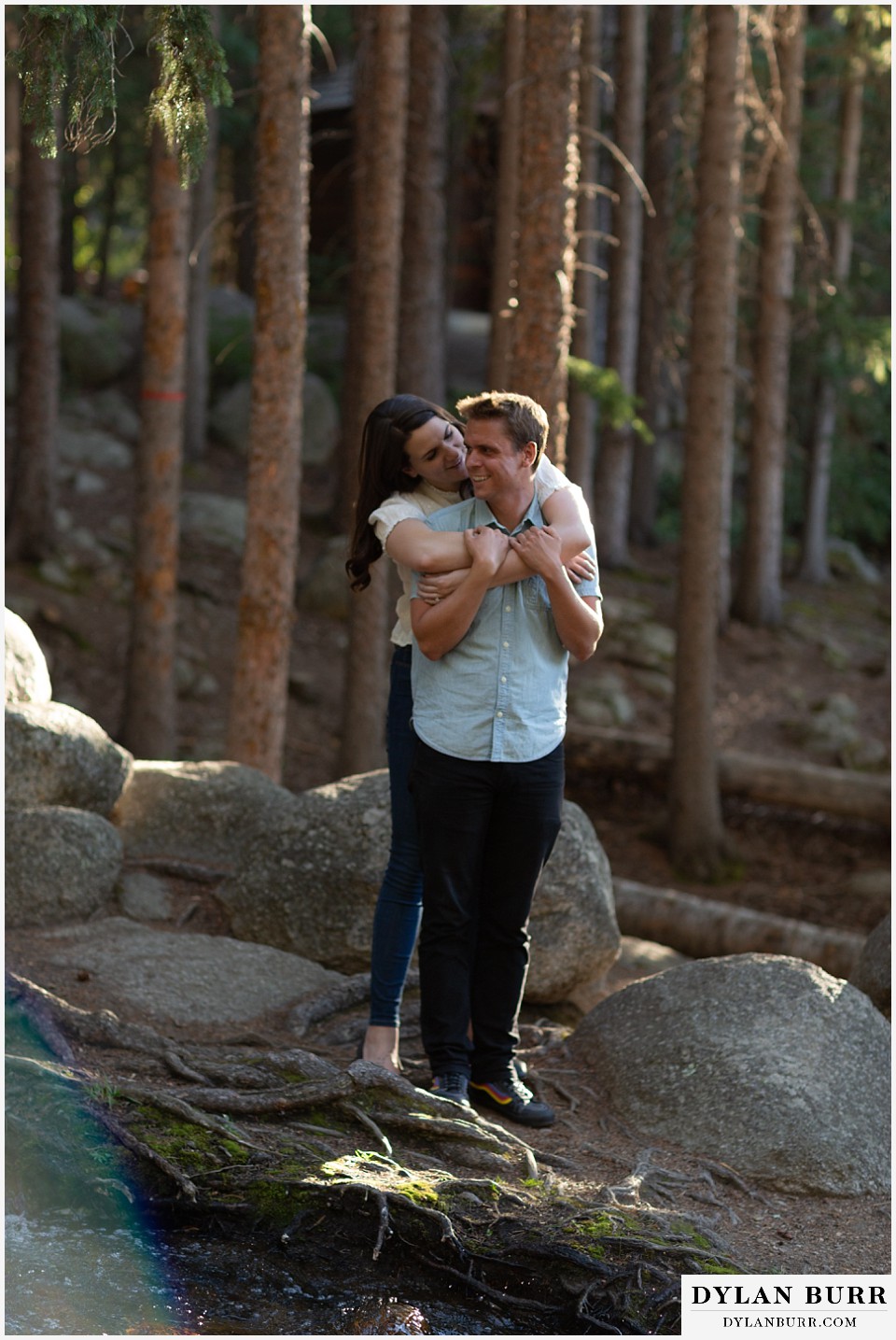 colorado mountain engagement photos colorado wedding photographer dylan burr close up of couple hugging near river
