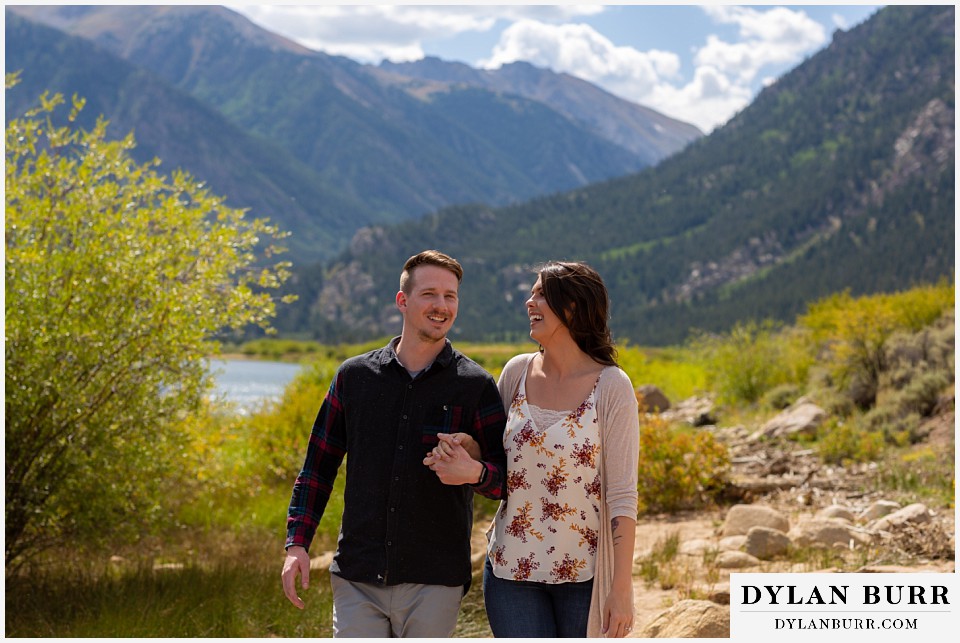 colorado mountain enagagement photos couple laughing and walking