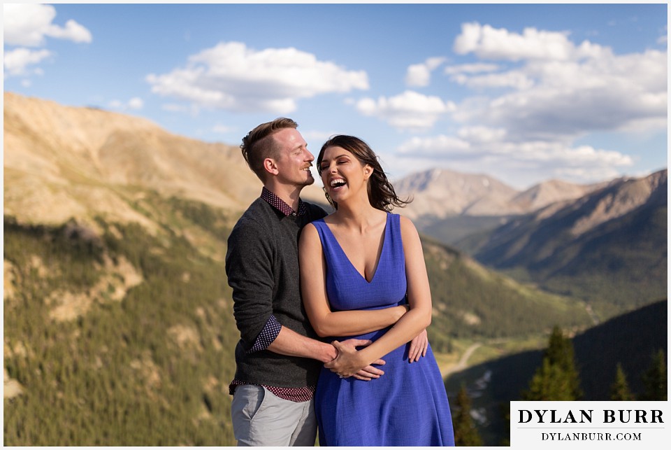 colorado mountain enagagement photos couple laughing in high mountain tops