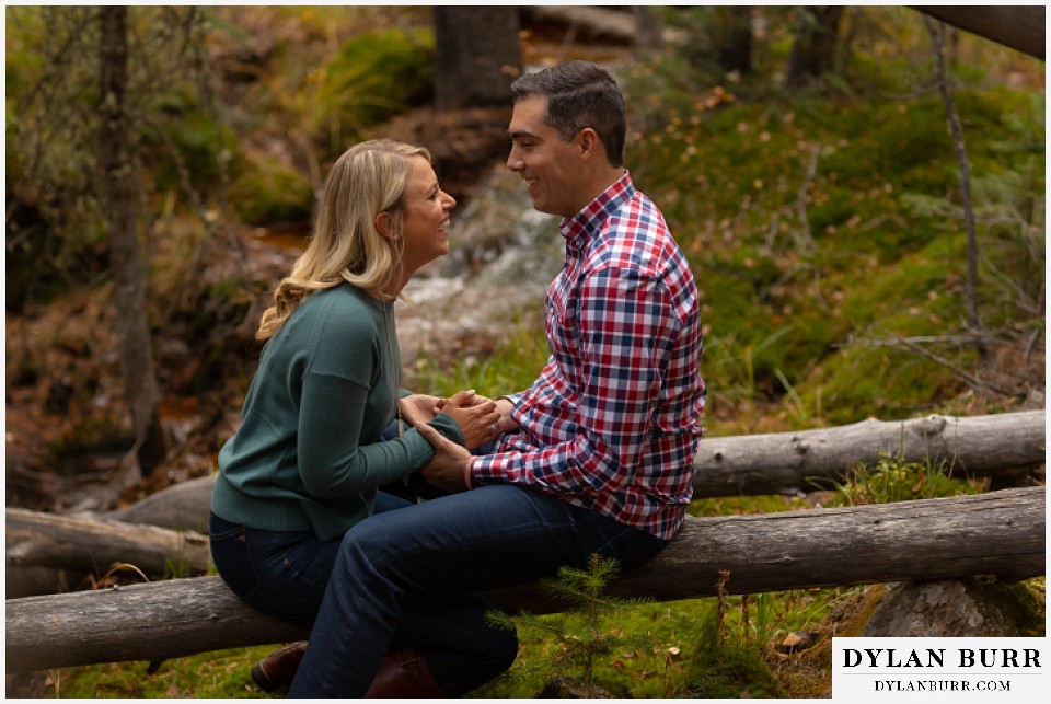 colorado mountain engagement session couple laughing