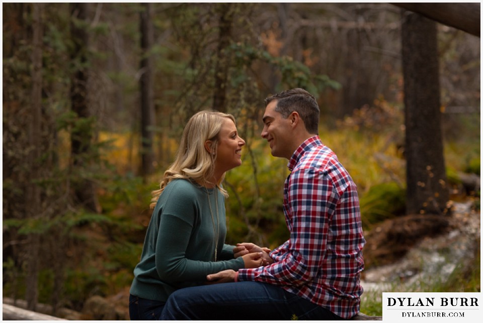 colorado mountain engagement session laughing with each other