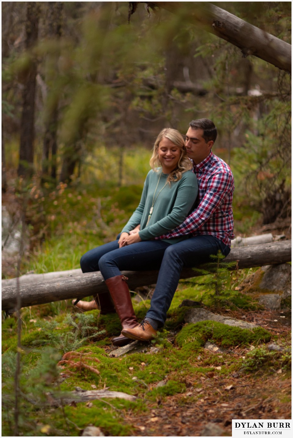 colorado mountain engagement session couple snuggling