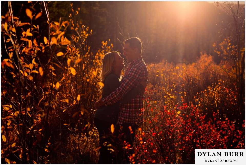 colorado mountain engagement session couple at sunset laughing